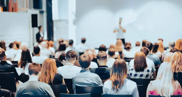 Rear View Of People During a presentation